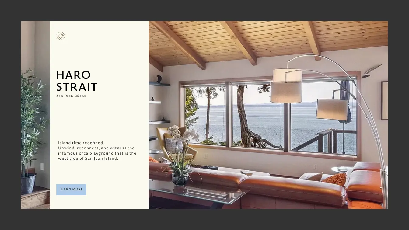 Living room with large window view of ocean at Esterre's Haro Strait property, San Juan Island.