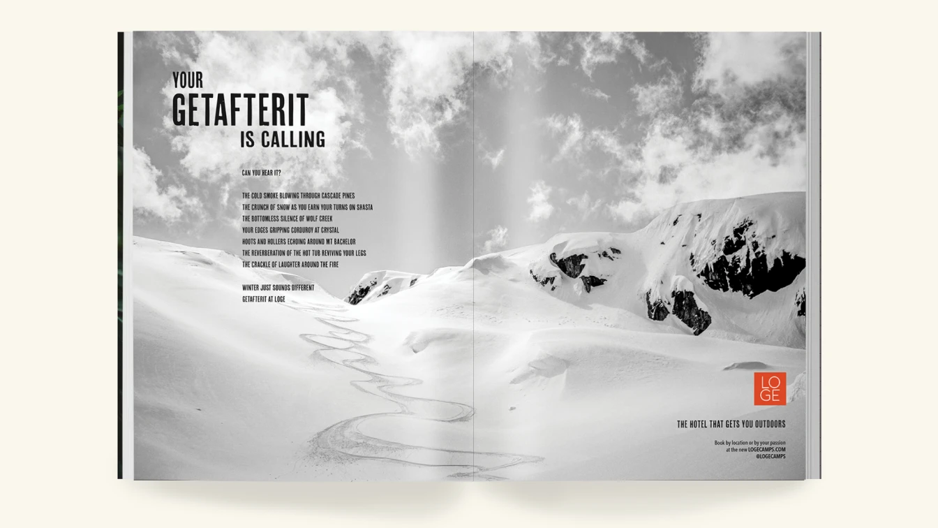 A two-page magazine spread featuring a black and white photograph of a snow-covered mountain landscape with winding ski tracks. The left page displays the text "YOUR GETAFTERIT IS CALLING" in bold, followed by the copy: "Can you hear it? The cold smoke blowing through Cascade Pines, the crunch of snow as you earn your turns on Shasta, the bottomless silence of Wolf Creek, your edges gripping corduroy at Crystal, hoots and hollers echoing around Mt. Bachelor, the reverberation of the hot tub reviving your legs, the crackle of laughter around the fire. Winter just sounds different. Getafterit at Loge." The Loge Camps logo and the tagline "The Hotel That Gets You Outdoors" are at the bottom right. The text encourages booking by location or passion at logecamps.com.