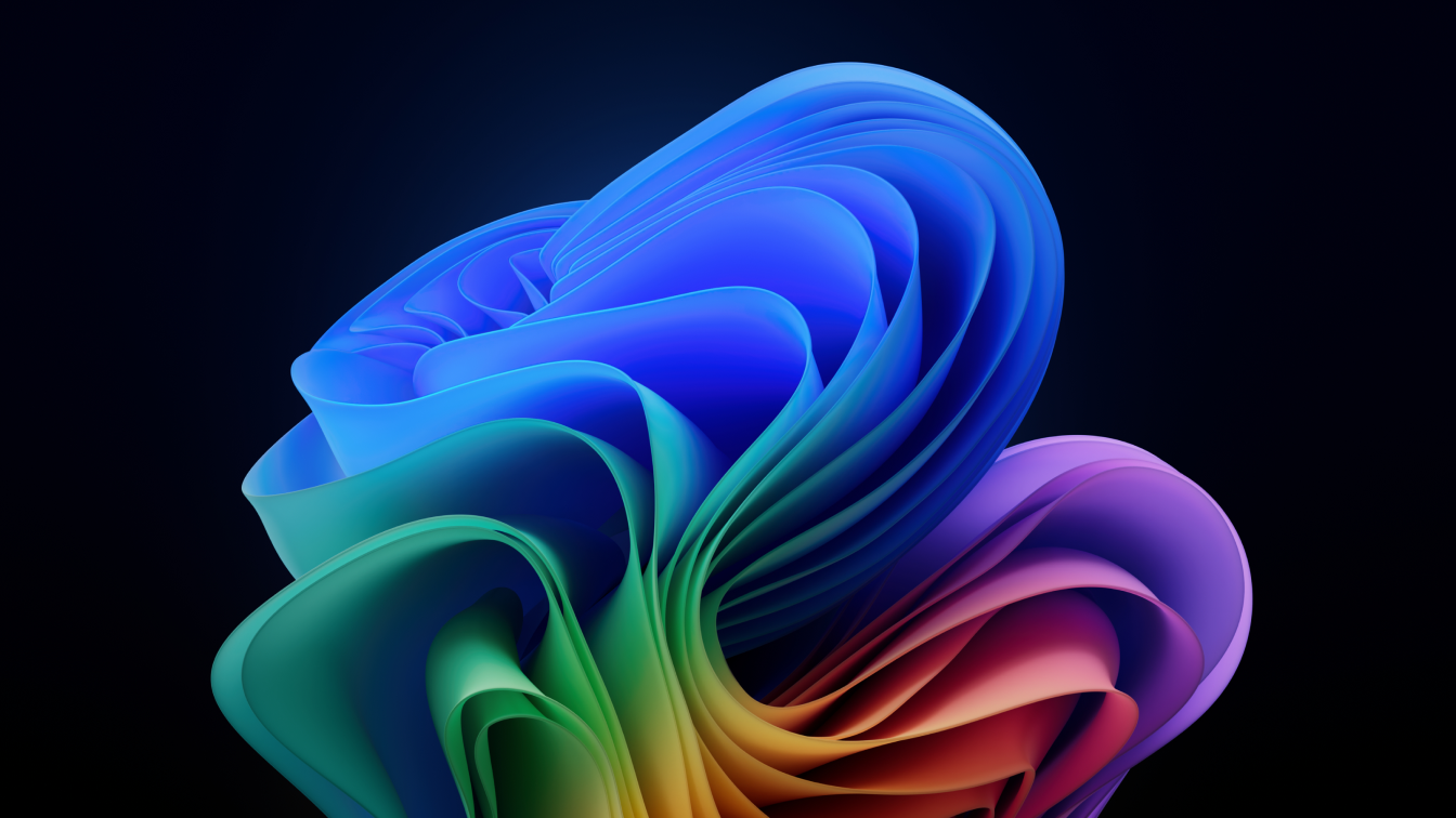 Abstract Windows 11 bloom wallpaper with colorful folded shapes in blue, green, and purple