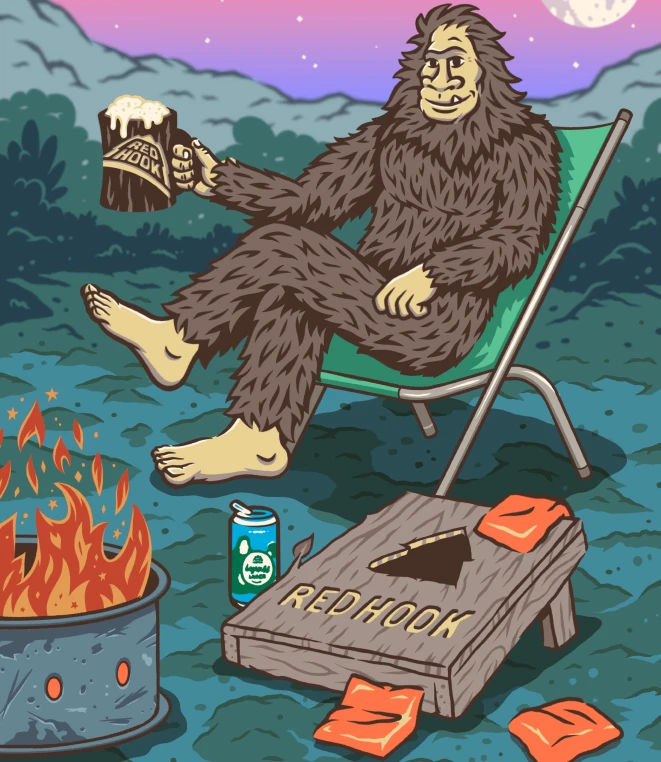 An illustration featuring a friendly sasquatch relaxing in a camping chair by a campfire against a nighttime wooded hill scene. The sasquatch is holding a frothy mug with the Red Hook logo.