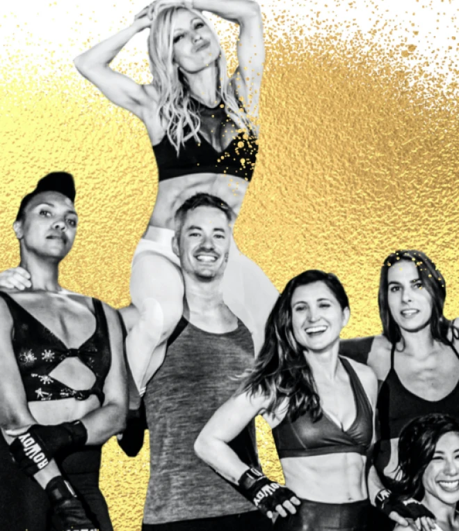 A group of fit, smiling individuals in sportswear, including boxing gloves, pose together against a gold textured background.