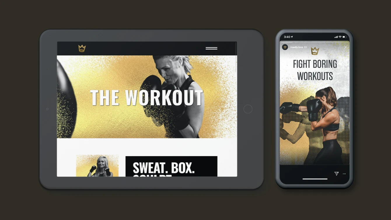 Promotional image featuring RowdyBox on a tablet and smartphone, both showing a woman in boxing gloves. The tablet displays the text "The Workout" and the smartphone shows the text "Fight Boring Workouts".